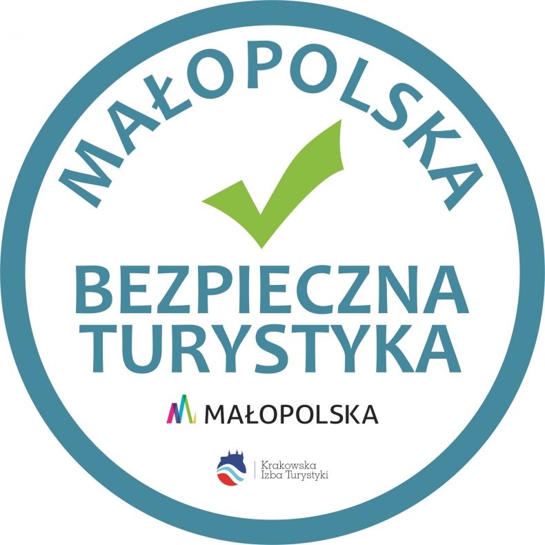 Okrągłe logo z napisem Małopolska Bezpieczna Turystyka