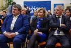 Poseł Patryk Wicher, radna województwa Marta Mordarska, siedzą w pierwszym rzędzie.