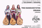 Baner z informacjami o koncercie. Z lewej strony fotografia trzech kobiet z instrumentami.