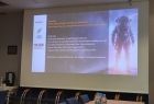 Slajd z kosmonautą informujący o wydarzeniu 