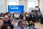 Widok na audytorium. W tle logotyp Funduszy Europejskich.