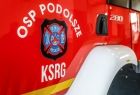 Napis OSP Pdolsze na drzwiach strażackiego wozu bojowego